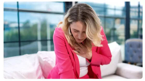 Man experiencing chest pain, a key indicator of potential heart issues.