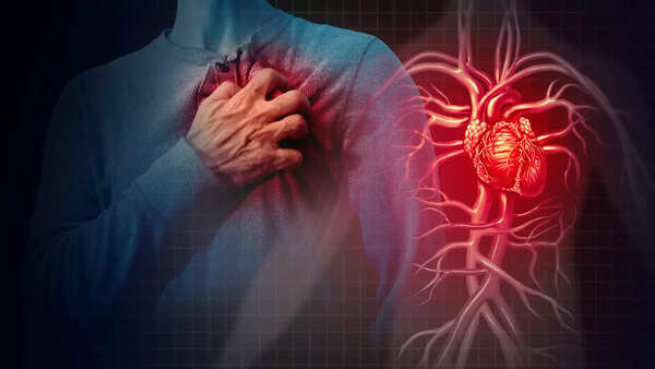 Close-up of a hand on chest, signifying heart palpitations.