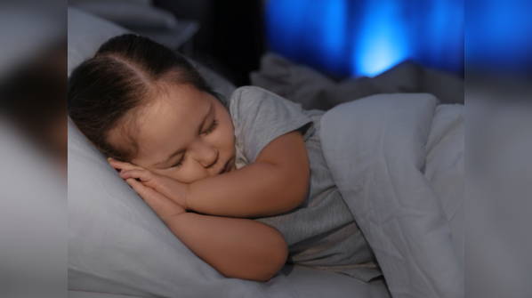 Child sleeping peacefully in bed