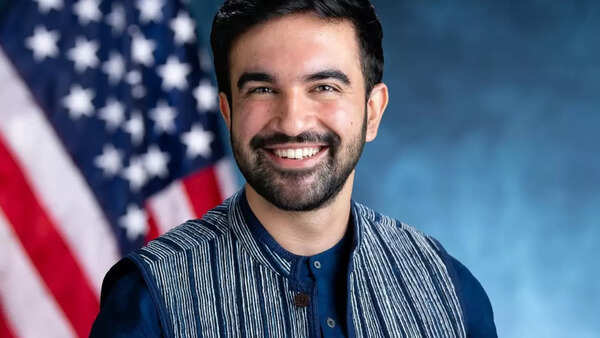 Zohran Mamdani sporting a Nehru-collar shirt under a blazer, blending South Asian roots with modern style.